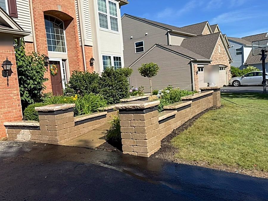 Terraced block retaining wall running along a driveway in Naperville, Illinois